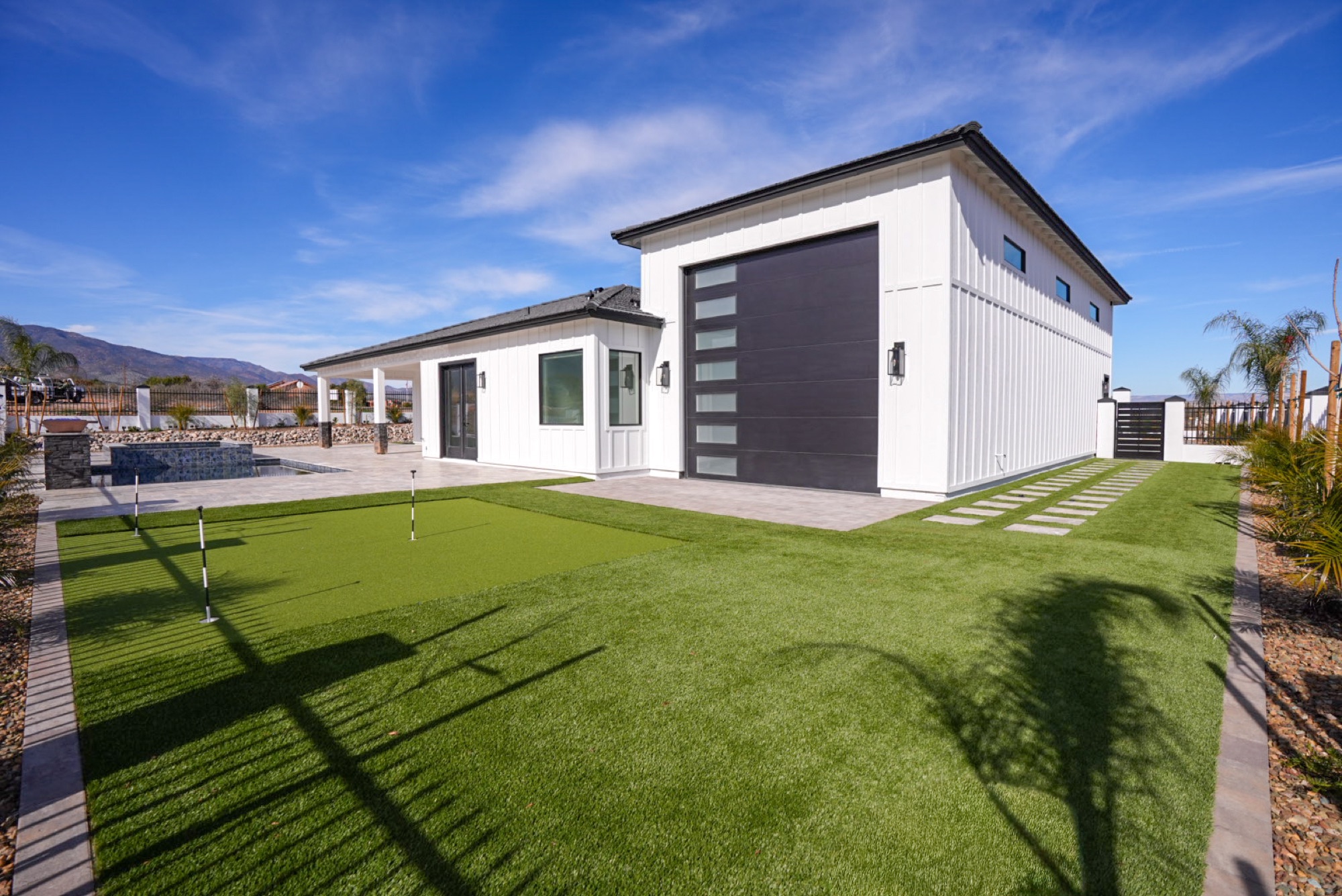 Backyard turf and putting green in daylight