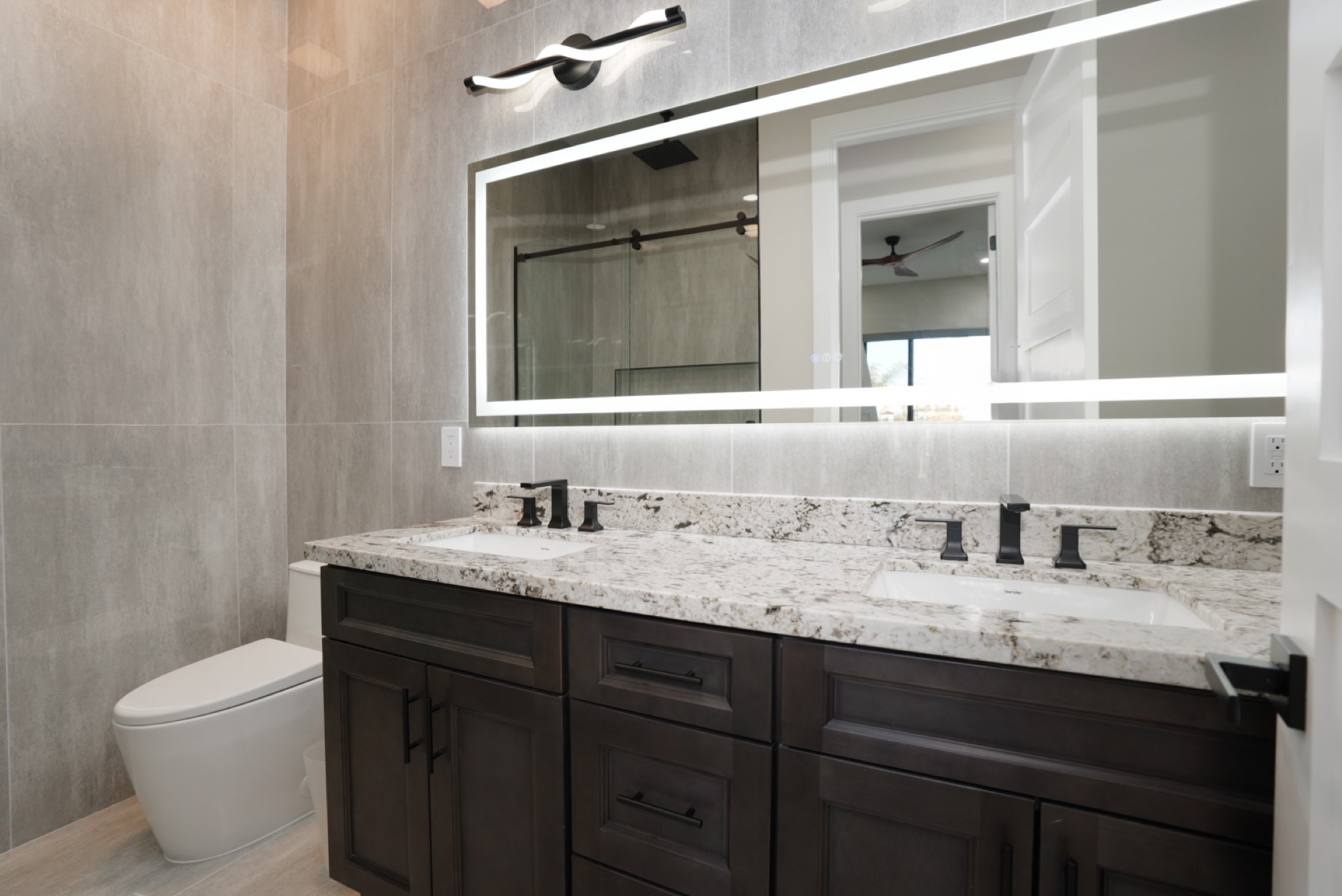 Dual vanity with backlit mirror