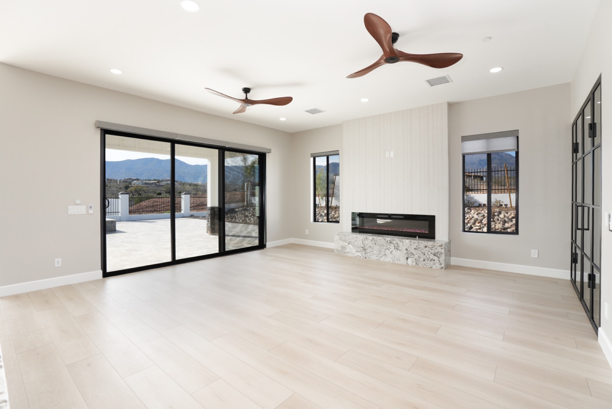 Great room in bright daylight with sliding glass