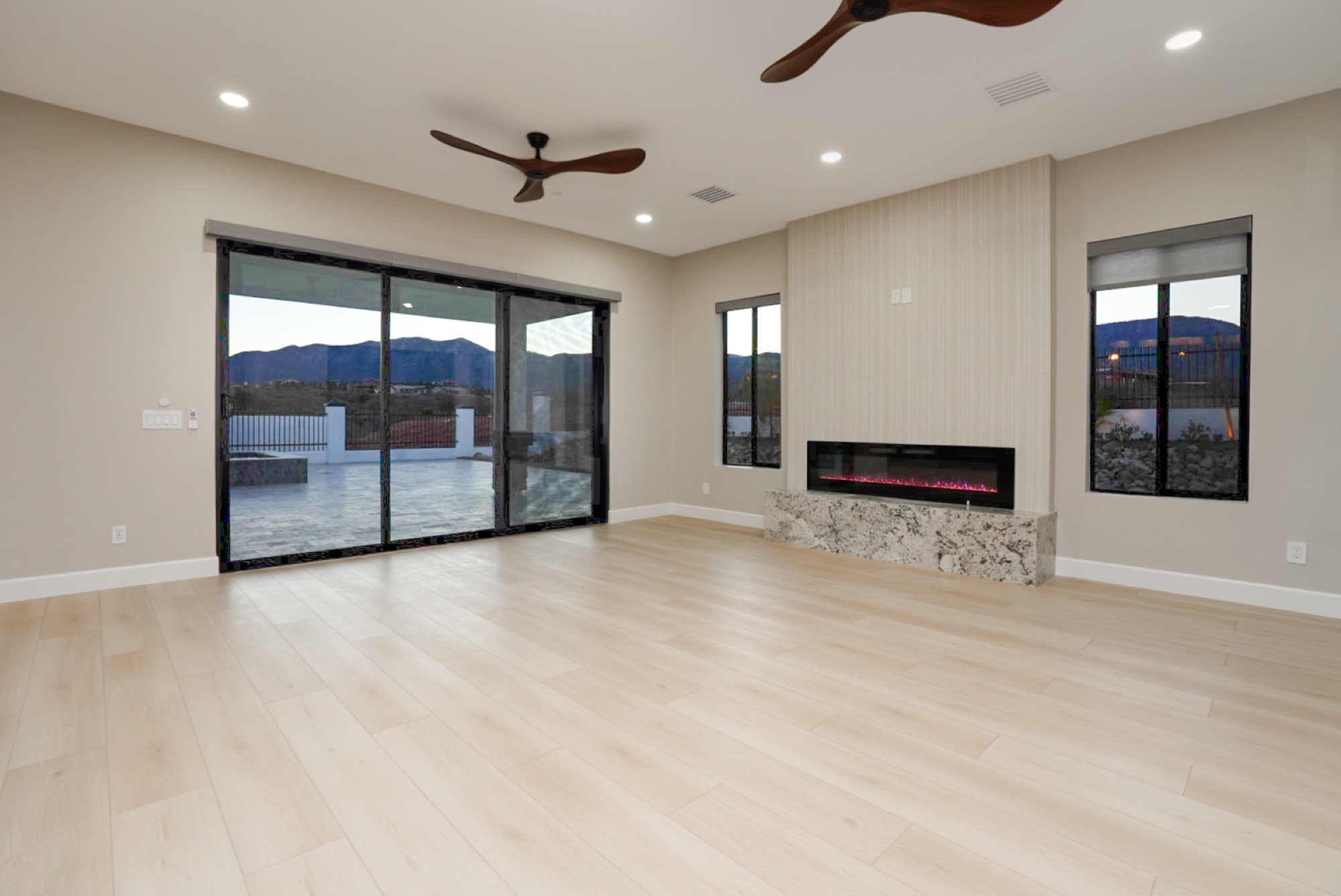 Great room with fireplace and walls of glass