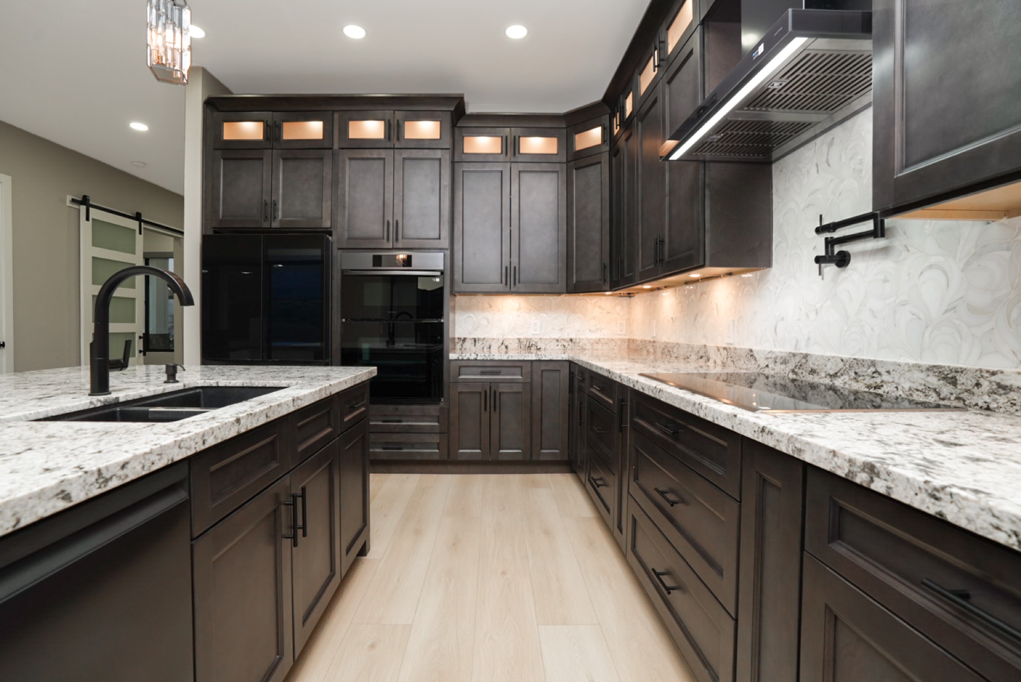 Kitchen wall with pot filler and vent hood