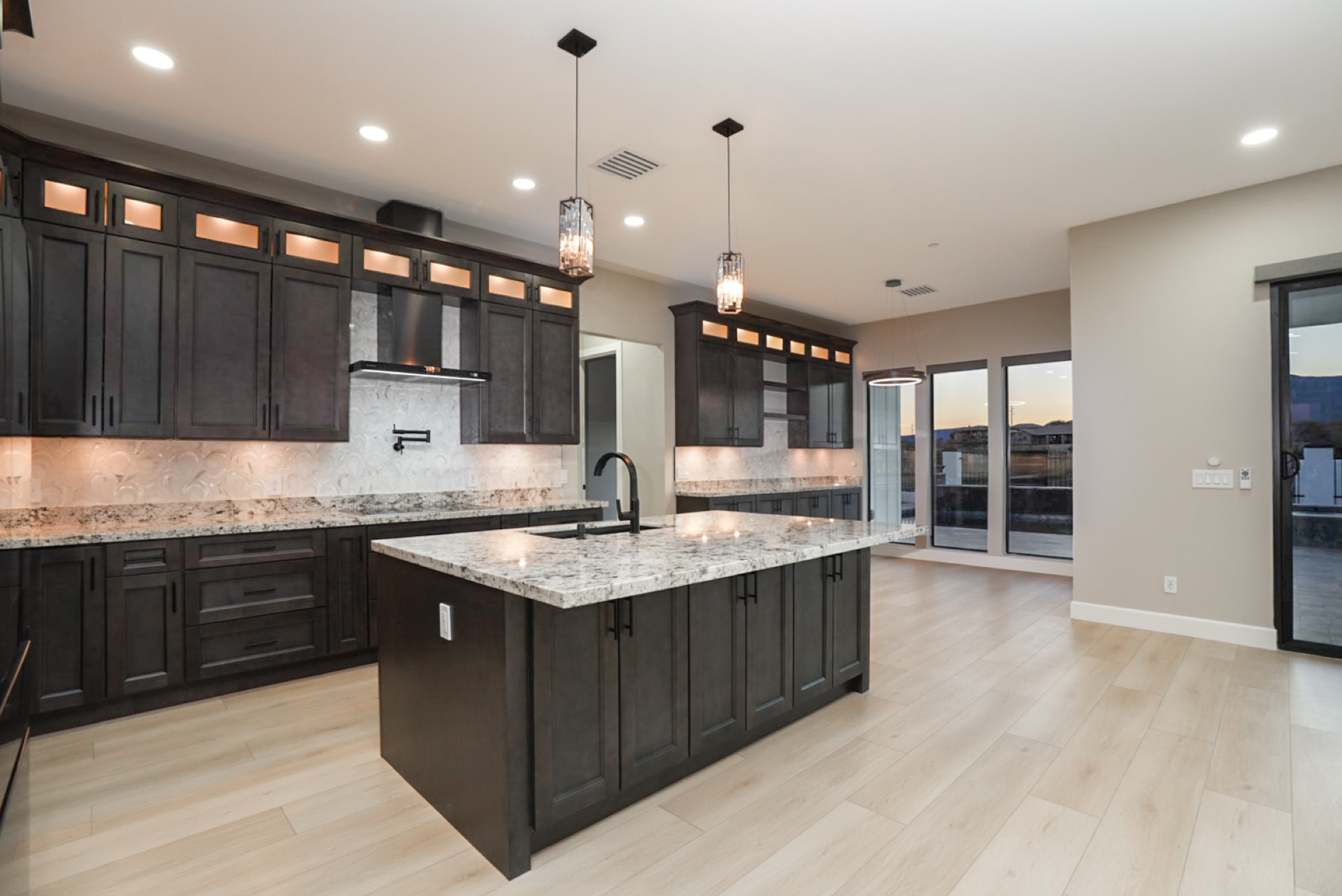 Oversized kitchen island with granite counters