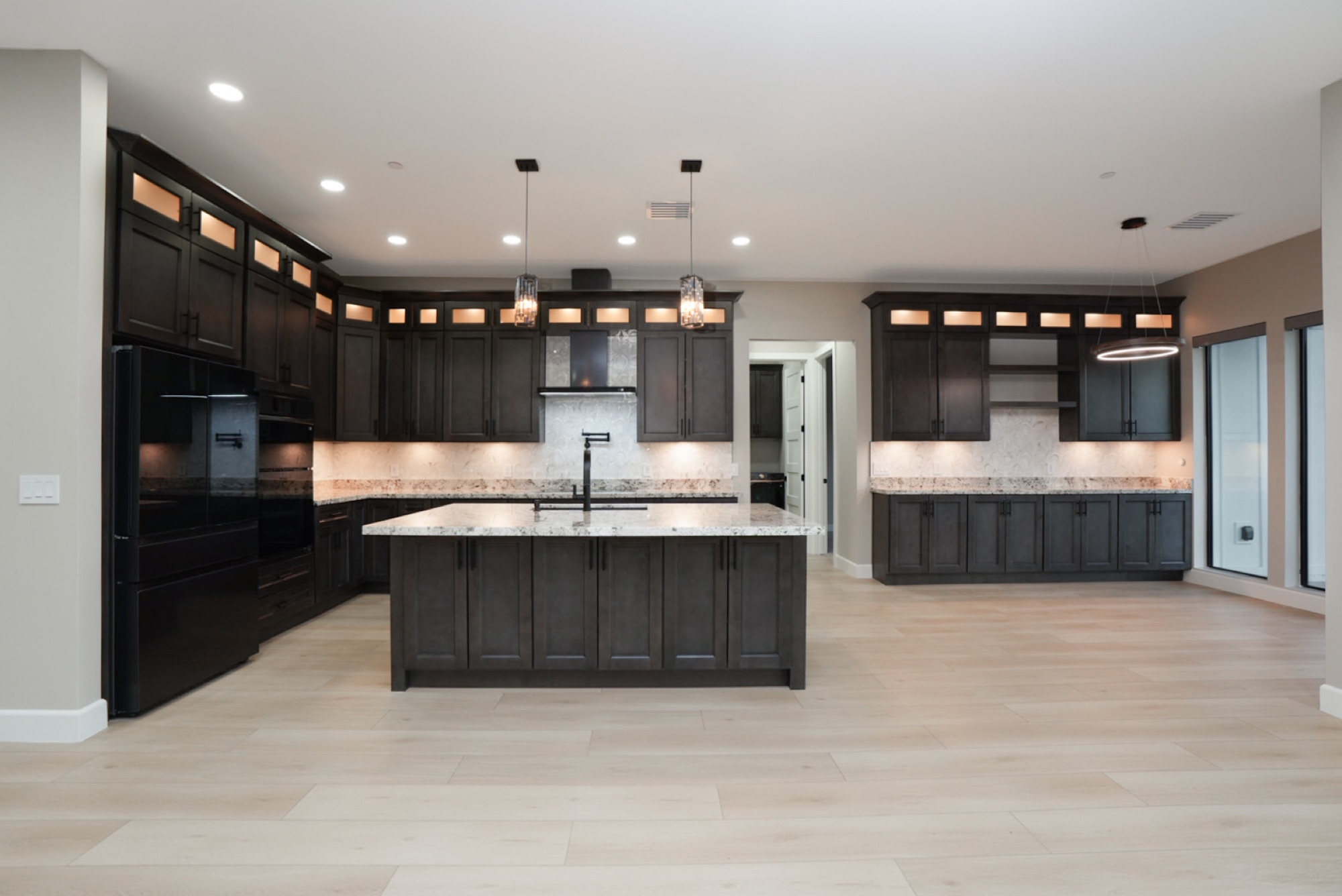 Kitchen with rich cabinetry and granite counters