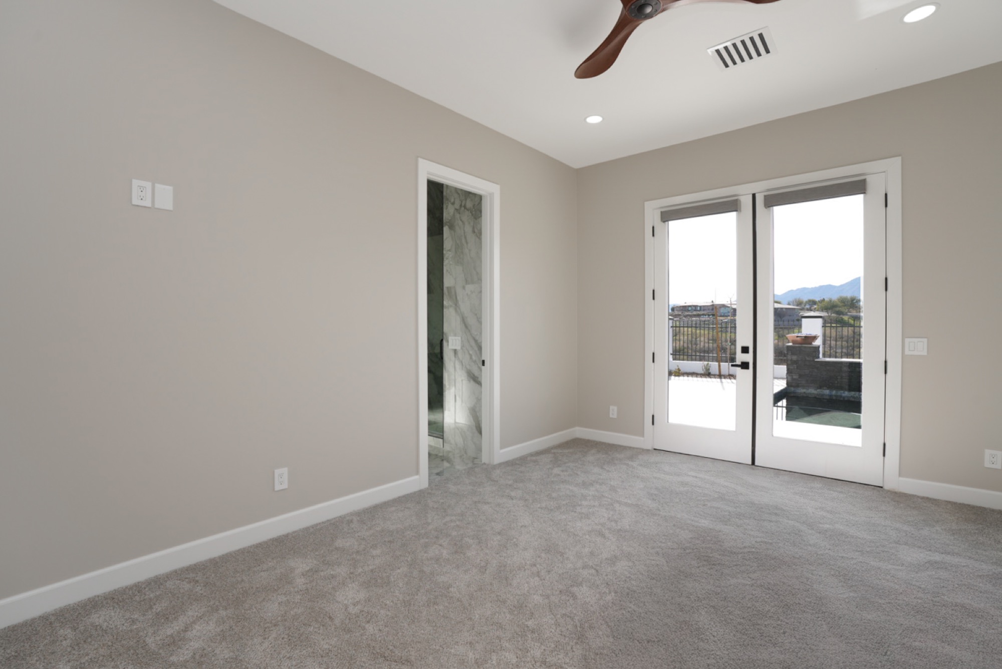 Owner's suite with French doors to the patio
