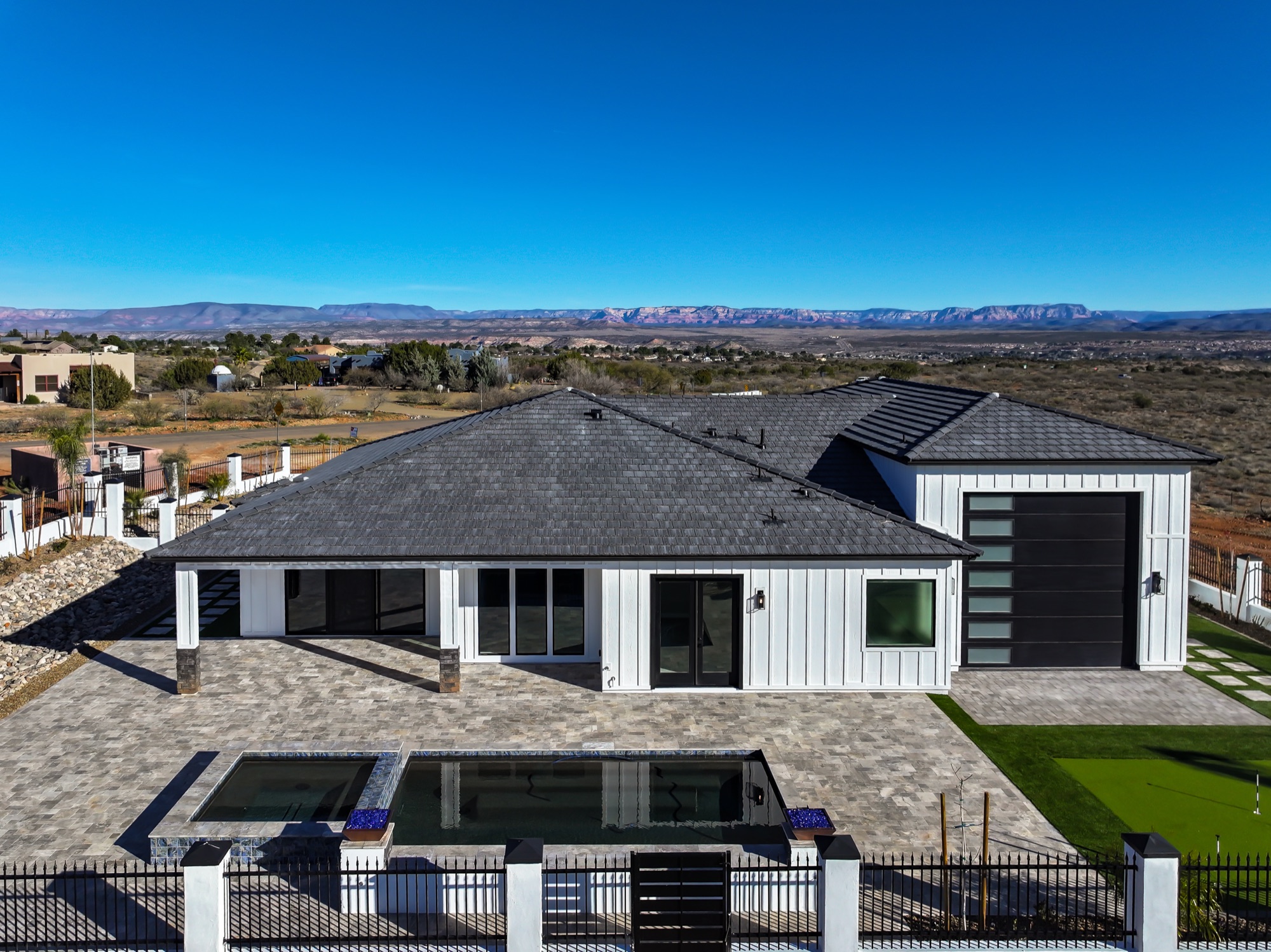 Aerial view of the home against the mountain backdrop