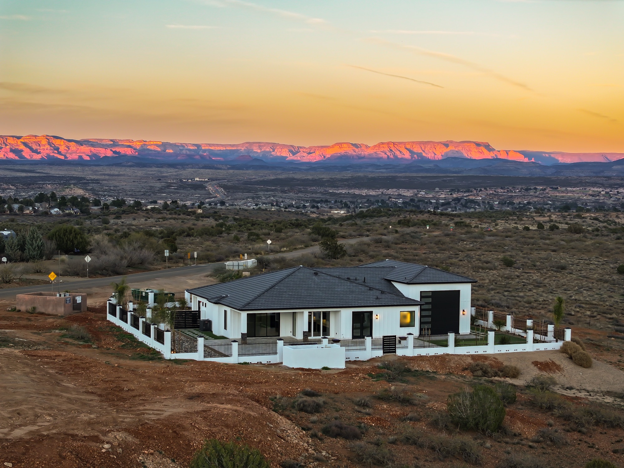 Aerial view at dusk with glowing red rock horizon